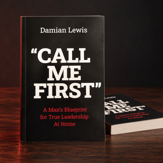 Call Me First paperback book by Damian Lewis on a dark wood surface