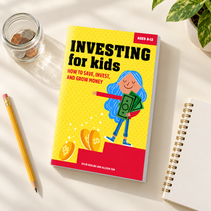 Investing for Kids book beside a savings jar and notebook